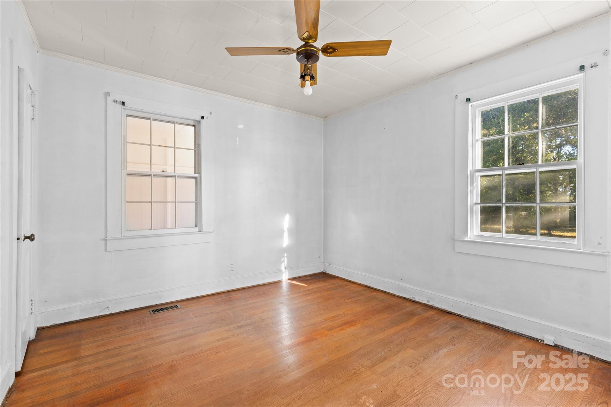811 South Cherry Road Rock Hill, SC 29730 - Photo 11 of 22 wooden floor in an empty room with a window