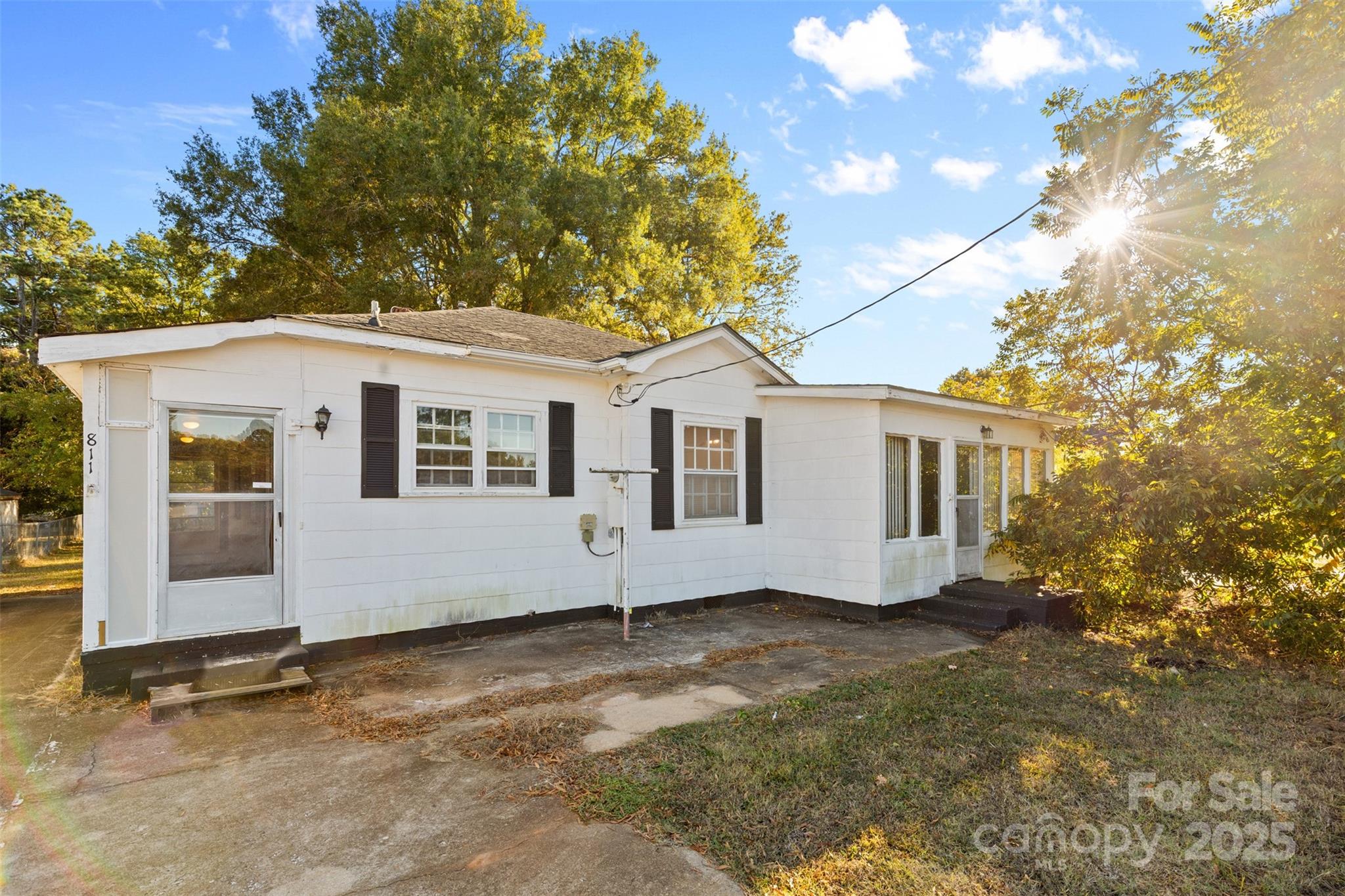 811 South Cherry Road Rock Hill, SC 29730 - Photo 2 of 22 a view of a white house with a big yard and large tree