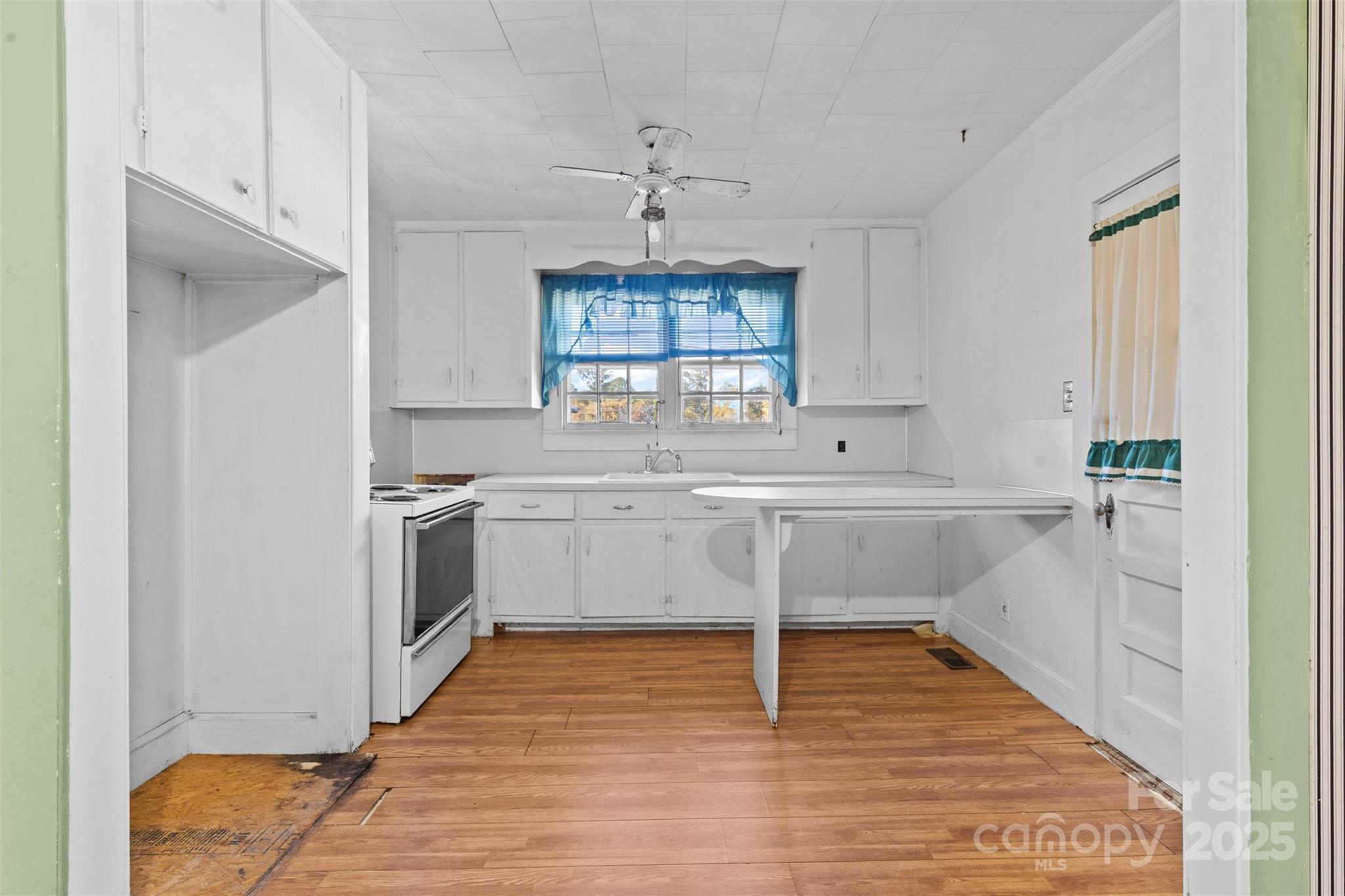 811 South Cherry Road Rock Hill, SC 29730 - Photo 5 of 22 a kitchen with white cabinets and window