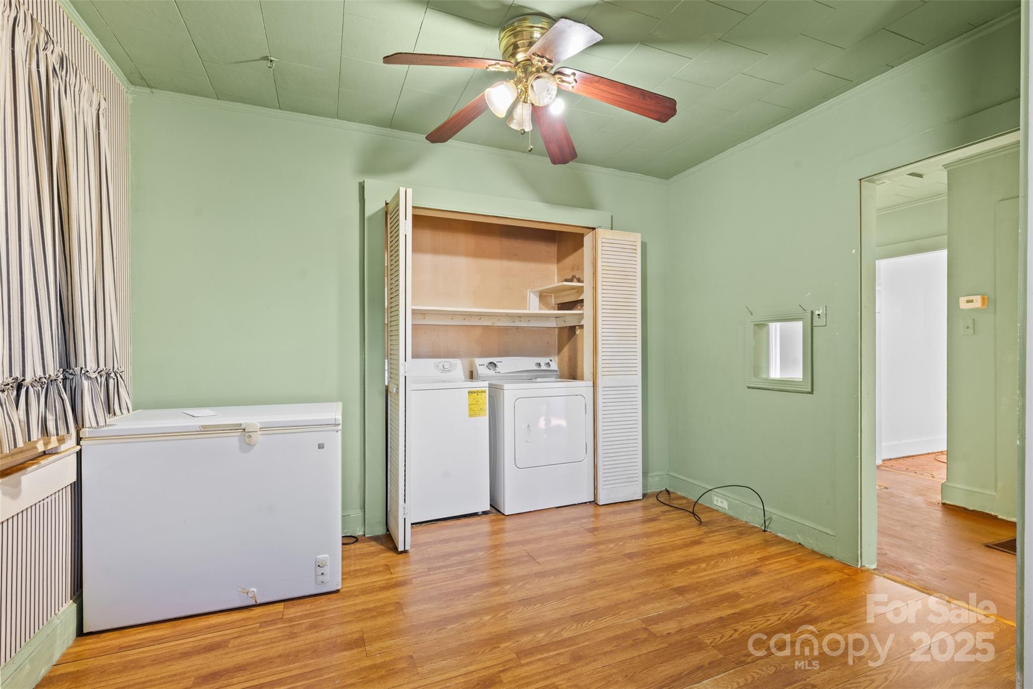 811 South Cherry Road Rock Hill, SC 29730 - Photo 6 of 22 a bedroom with a bed and a chandelier