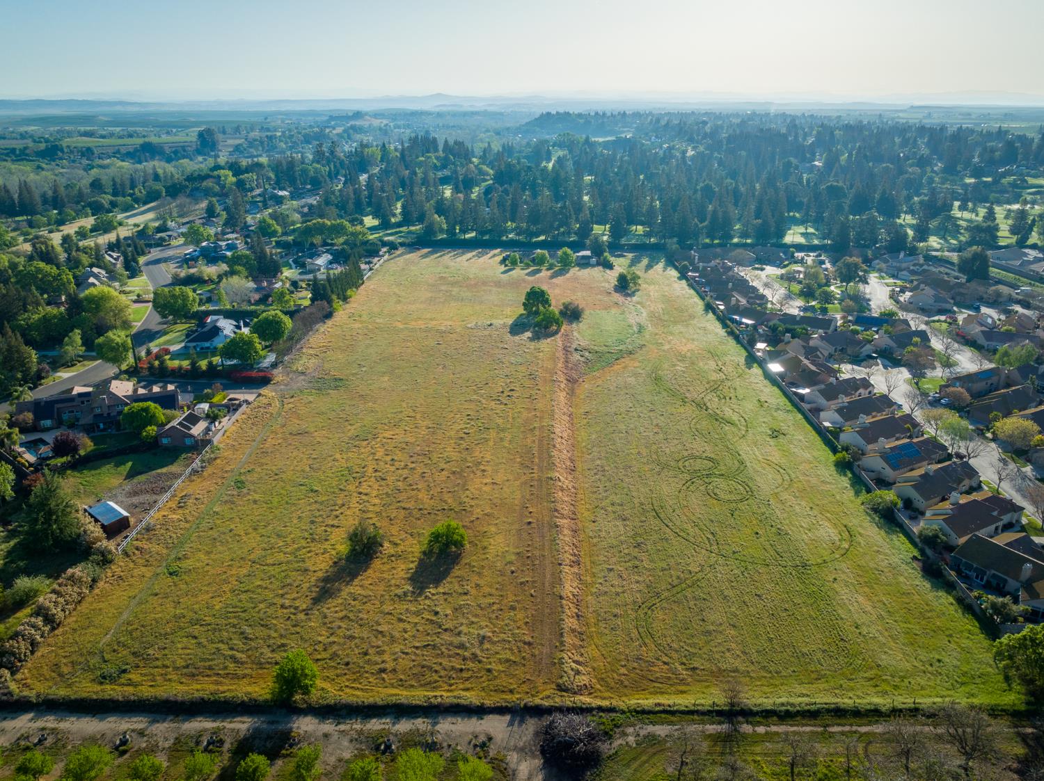 624 North Stearns Road Oakdale, CA 95361 - Photo 5 of 14 a view of a swimming pool with a yard and mountain view