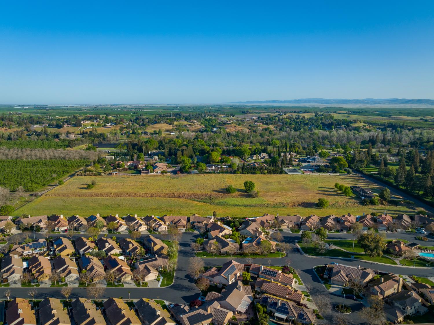 624 North Stearns Road Oakdale, CA 95361 - Photo 7 of 14 an aerial view of a city with lots of residential buildings and ocean view