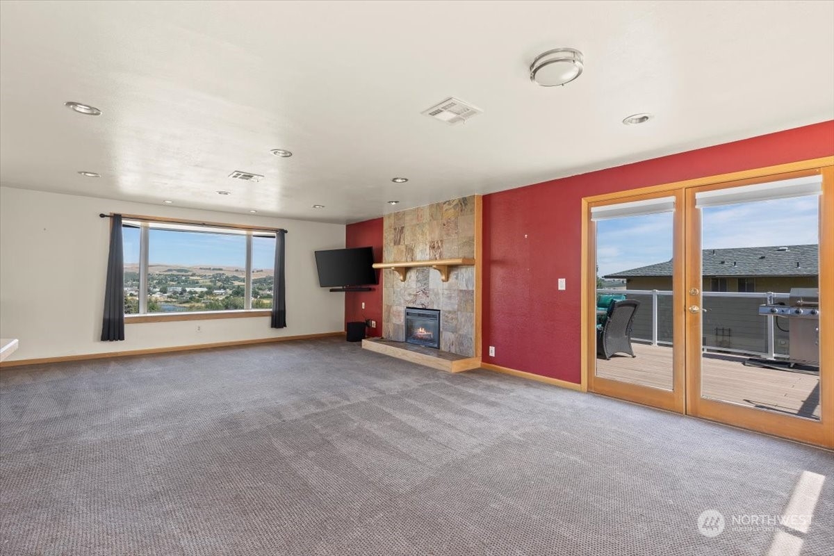120 Echo Glen Place Yakima, WA 98908 - Photo 11 of 40 a view of an empty room with furniture and a fireplace