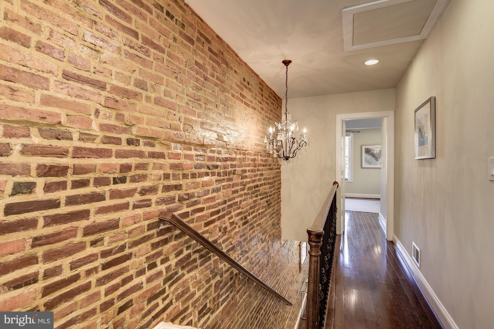 803 9th Street Northeast Washington, DC 20002 - Photo 18 of 52 Upstairs Hall with Exposed Brick