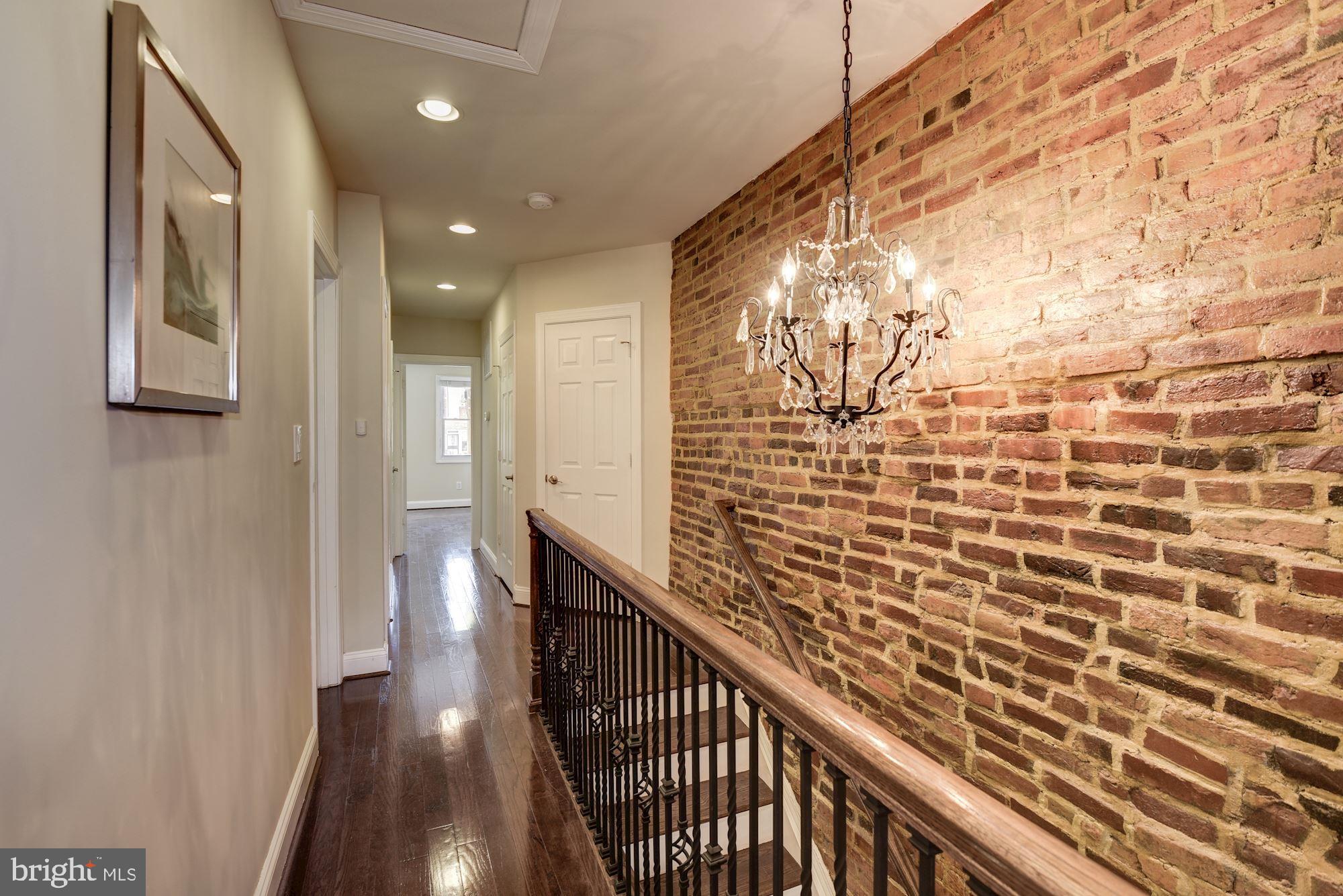 803 9th Street Northeast Washington, DC 20002 - Photo 19 of 52 Upstairs Hall with Exposed Brick