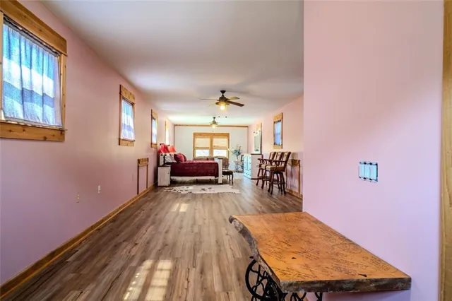 a view of a room with wooden floor and wooden floor