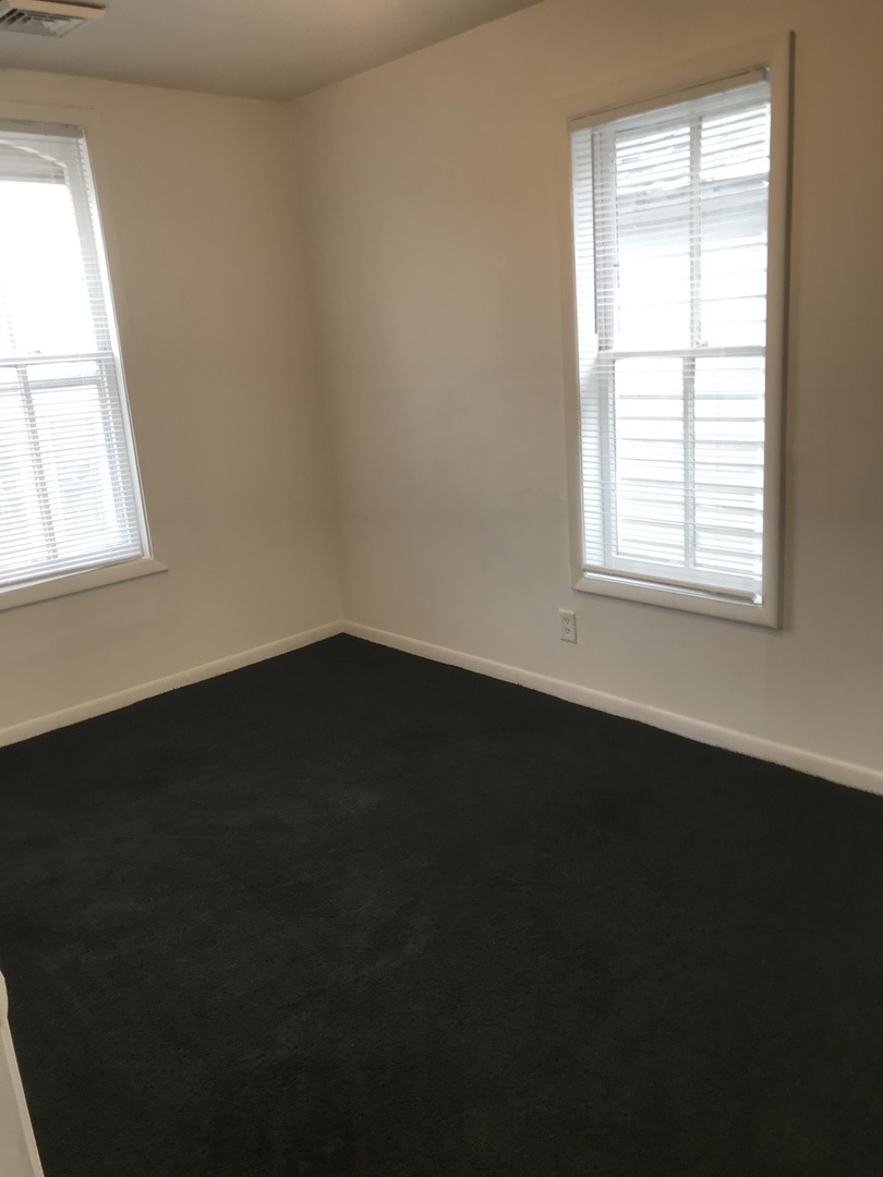 3929 Main Street, Unit 2 McHenry, IL 60050 - Photo 12 of 17 an empty room with a window