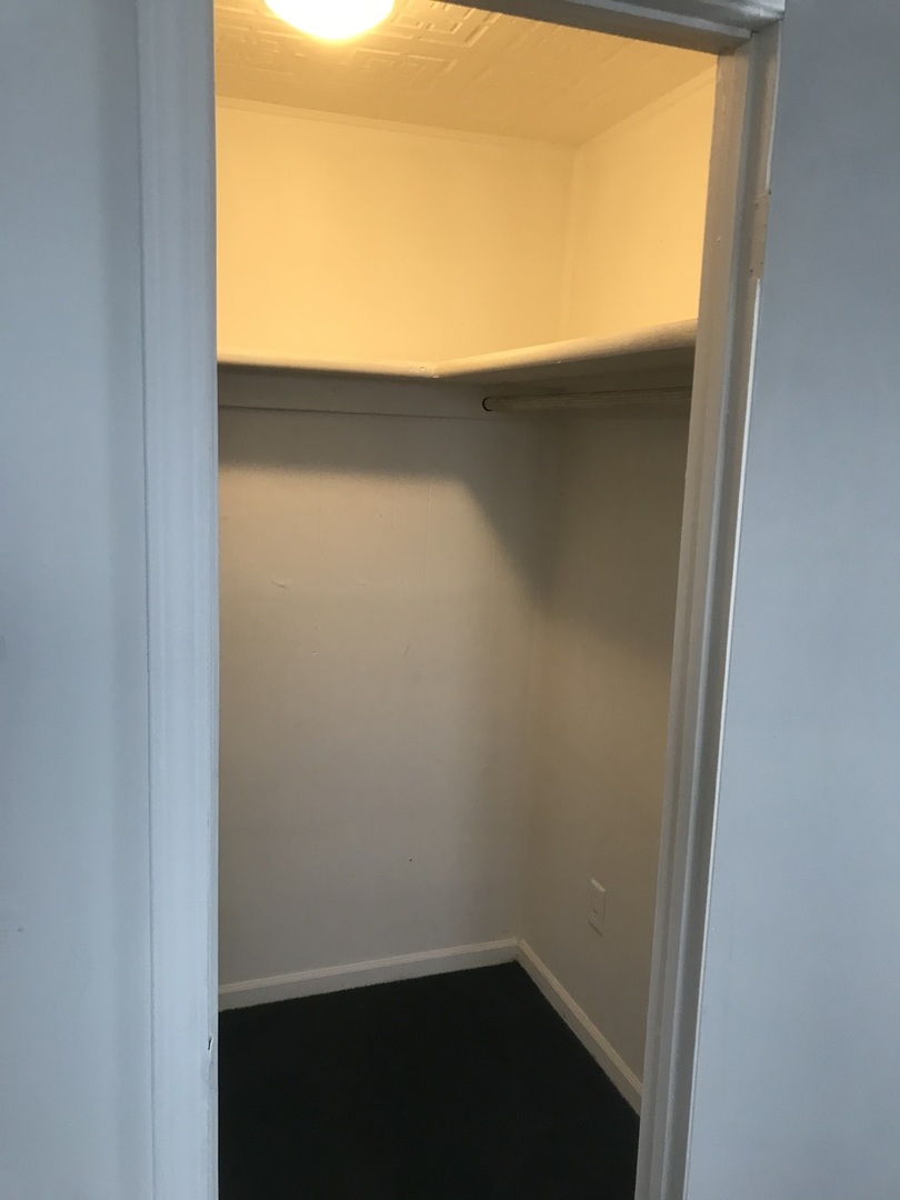 3929 Main Street, Unit 2 McHenry, IL 60050 - Photo 13 of 17 a view of a small space with wooden floor and a window