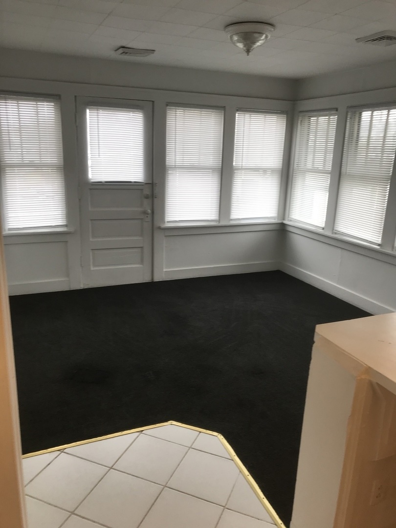 3929 Main Street, Unit 2 McHenry, IL 60050 - Photo 3 of 17 a view of an empty room with a window