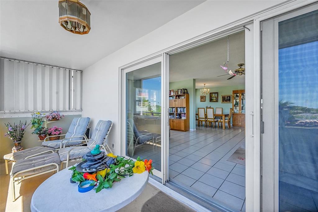 401 Briny Avenue, Unit 409 Pompano Beach, FL 33062 - Photo 36 of 62 a living room with furniture and a table