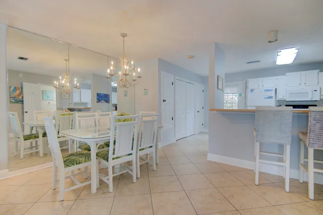 a kitchen with kitchen island and stainless steel appliances cabinets