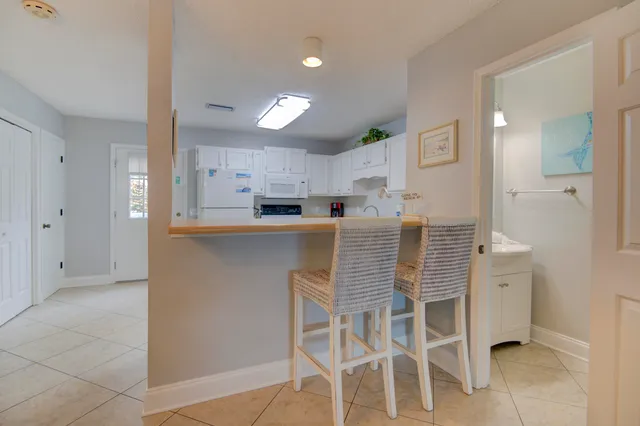 a kitchen with kitchen island granite countertop wooden cabinets and counter space
