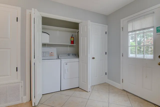 a view of kitchen with white cabinets