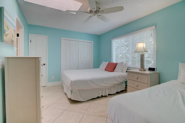 a bedroom with double bed and window