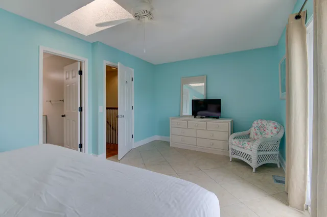 a bedroom with furniture and a bed