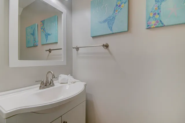 a bathroom with a sink and mirror