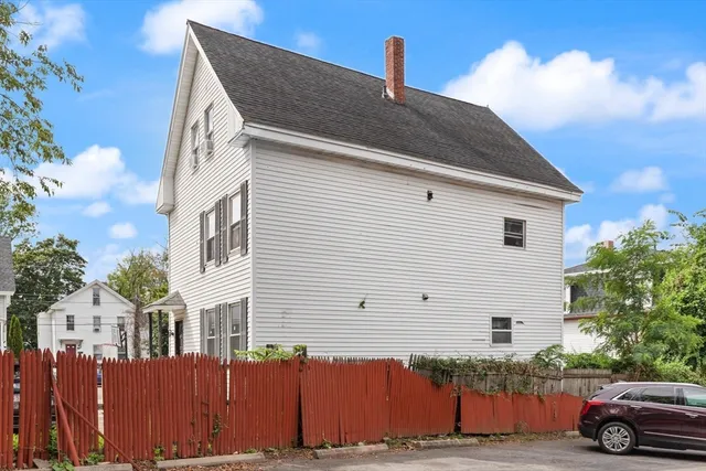 a front view of a house with a street
