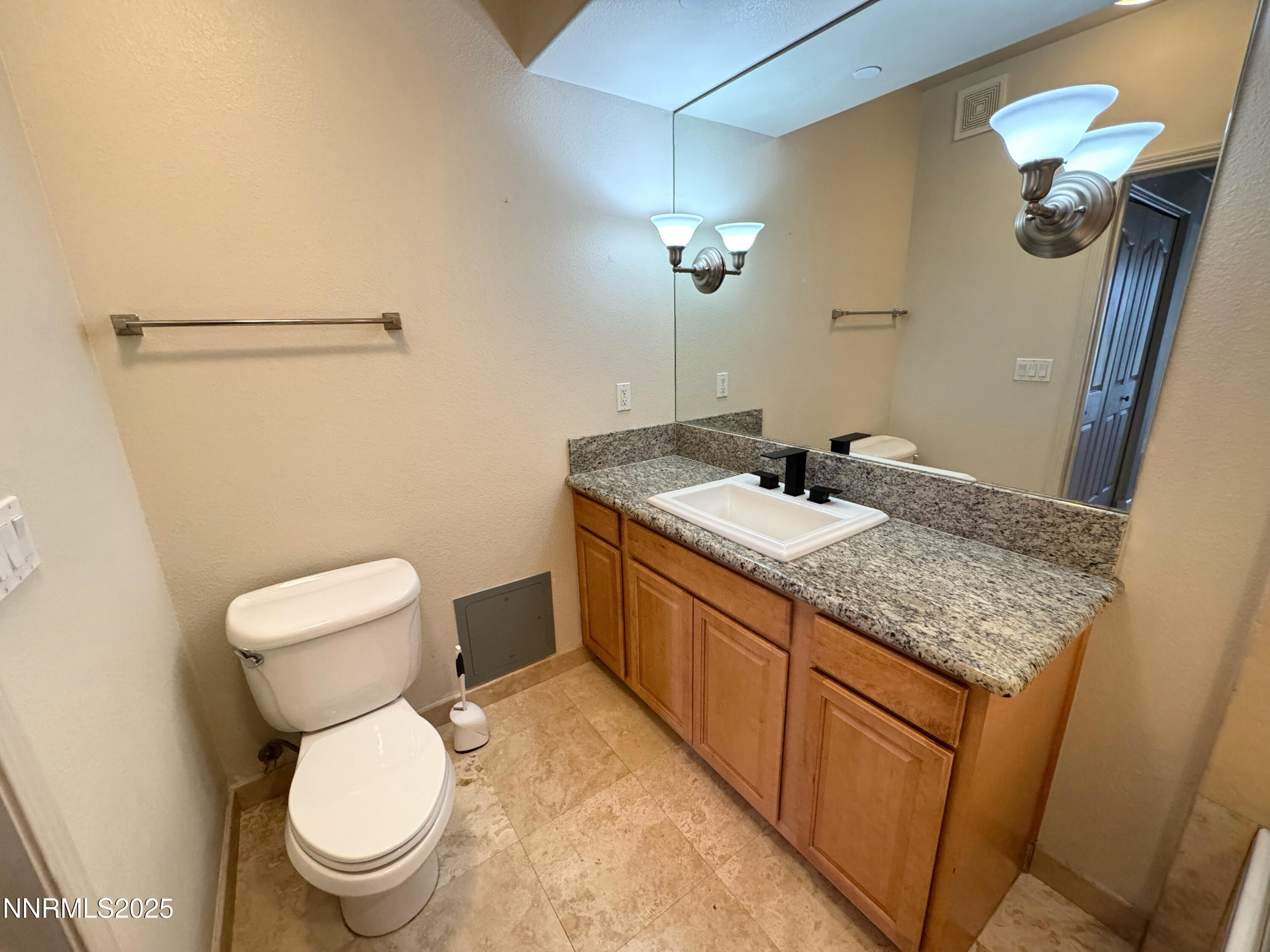 200 West 2nd Street, Unit 1107 Reno, NV 89501 - Photo 8 of 29 a bathroom with a granite countertop toilet sink and mirror