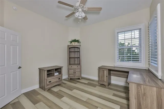 a view of workspace with furniture and window