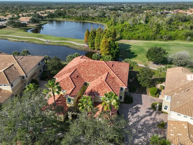 an aerial view of residential houses with outdoor space