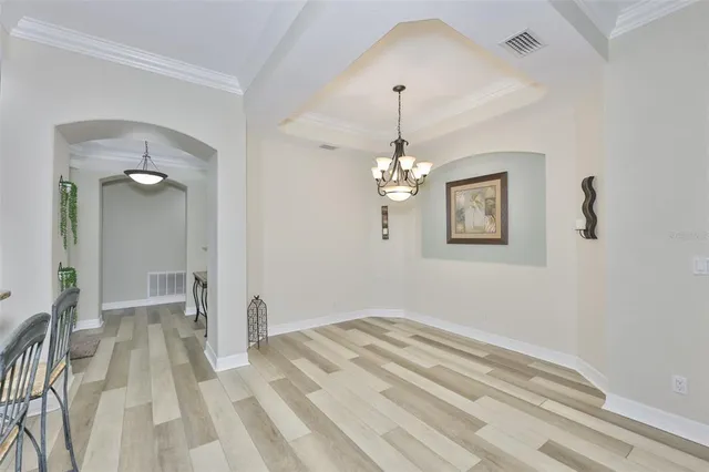 a view of a bedroom with a chandelier