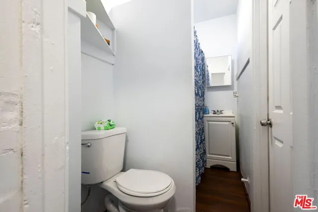 a kitchen with appliances a refrigerator and a sink
