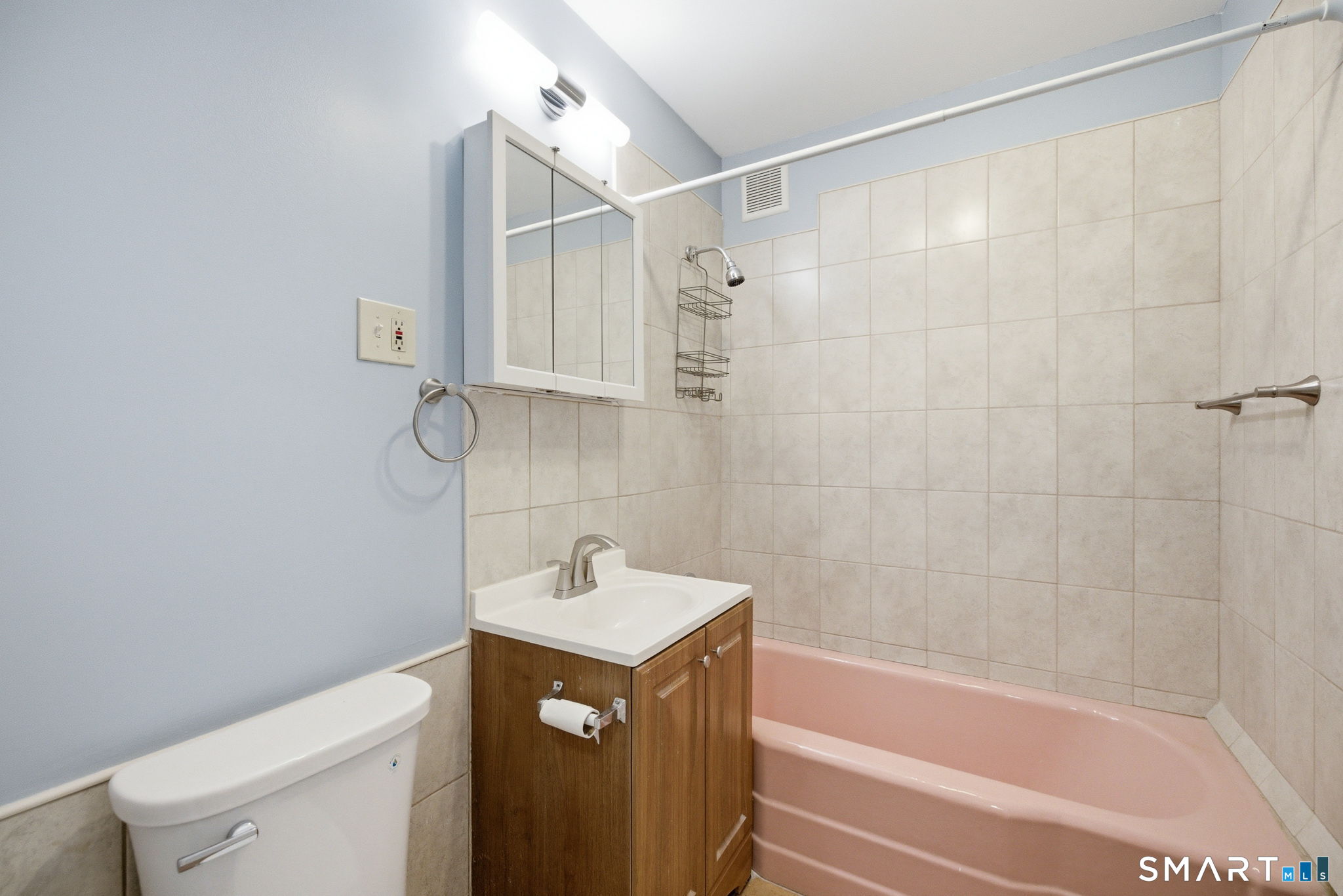 76 Harold Street Hartford, CT 06112 - Photo 10 of 12 a bathroom with a sink a toilet and shower