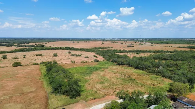 a view of a lake with lots of trees