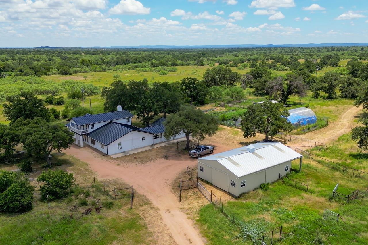 an aerial view of a house with garden space and outdoor space