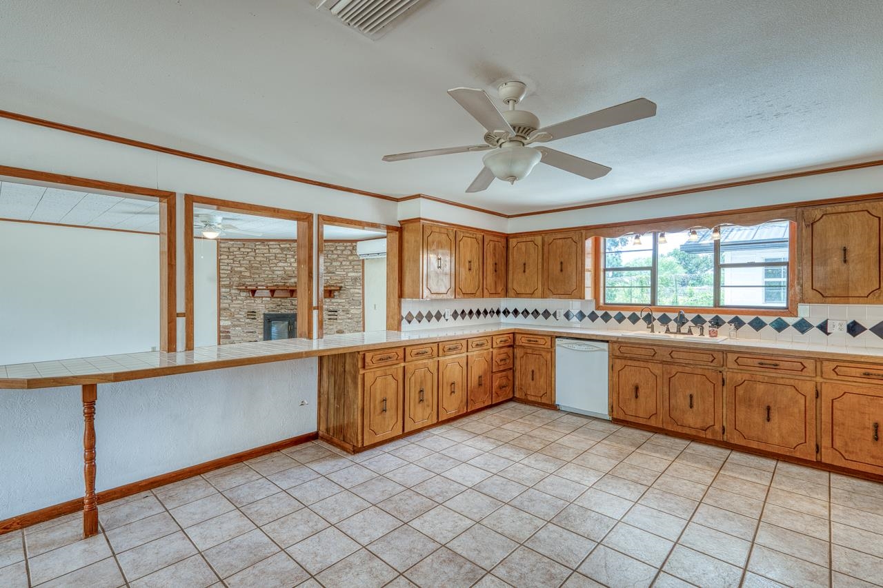 6552 Cr 403 Valley Spring Llano, TX 78643 - Photo 17 of 30 a large kitchen with a large window appliances and cabinets