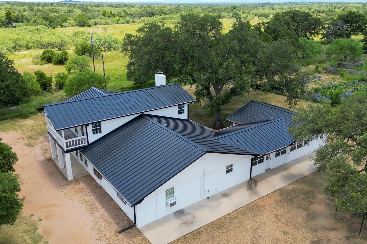 6552 Cr 403 Valley Spring Llano, TX 78643 - Photo 2 of 30 a view of a backyard with a deck and wooden floor