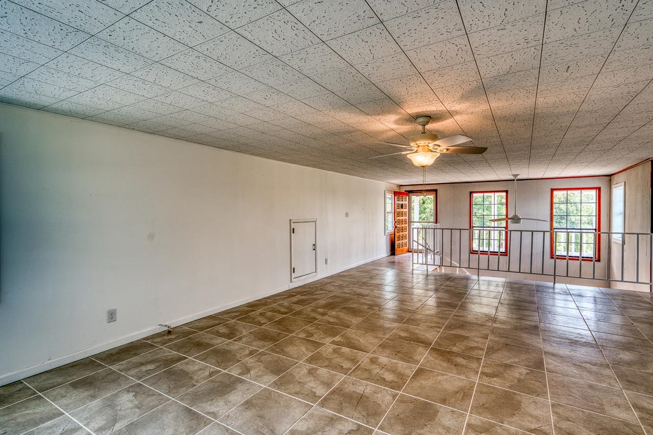 6552 Cr 403 Valley Spring Llano, TX 78643 - Photo 27 of 30 a view of an empty room with wooden floor and a window