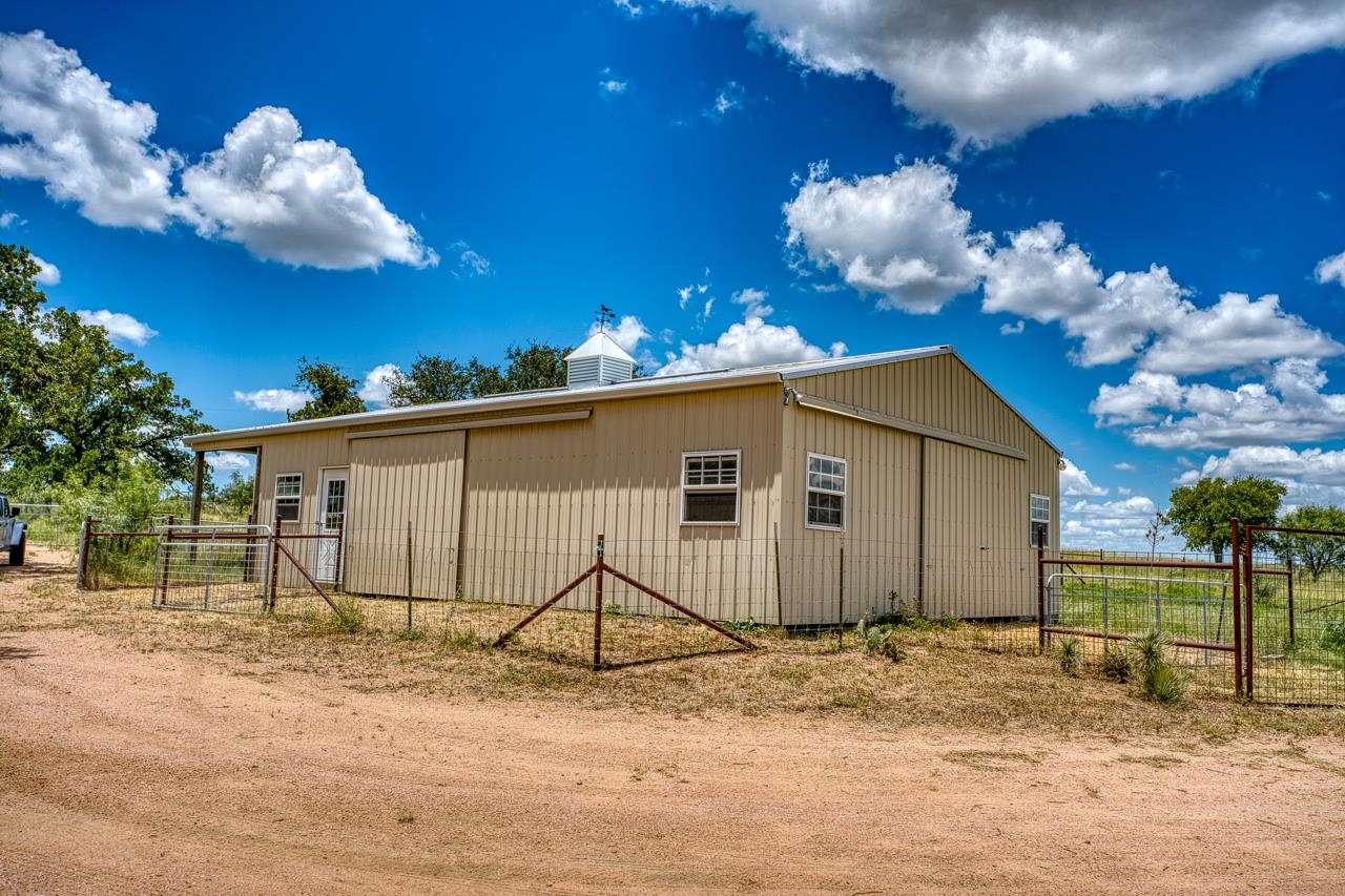 6552 Cr 403 Valley Spring Llano, TX 78643 - Photo 29 of 30 a view of a house with a yard