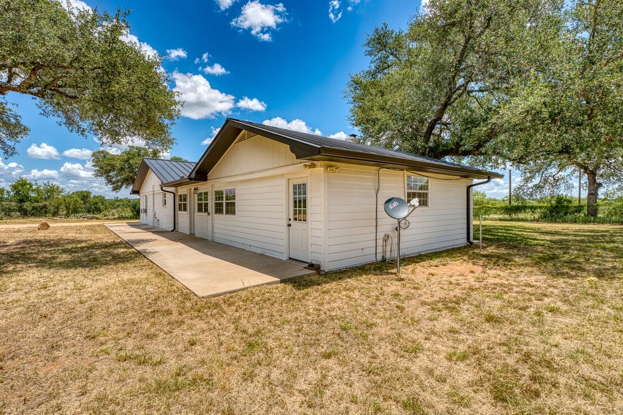 6552 Cr 403 Valley Spring Llano, TX 78643 - Photo 6 of 30 a view of a backyard with a tree