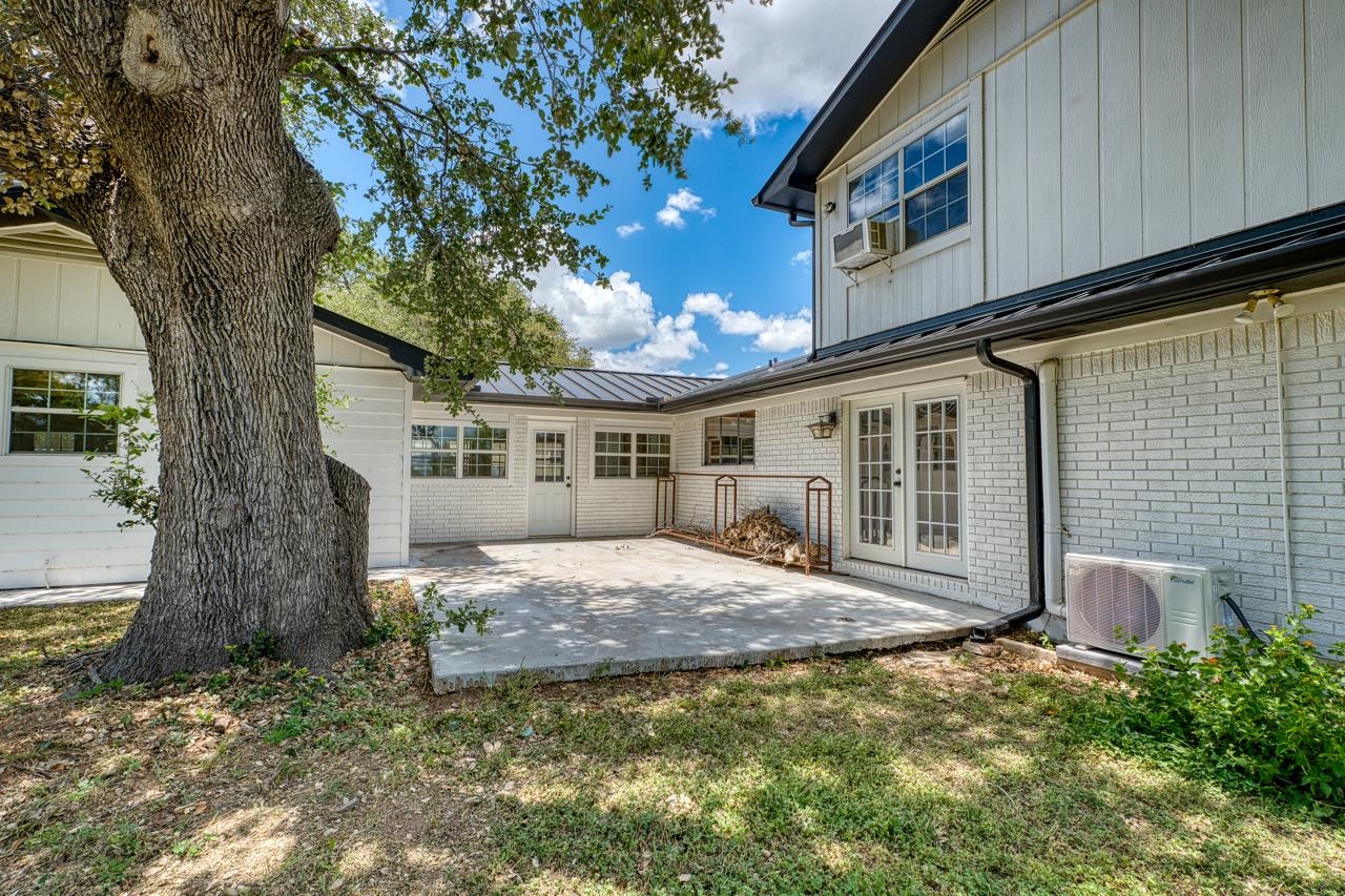 6552 Cr 403 Valley Spring Llano, TX 78643 - Photo 8 of 30 a front view of a house with garden