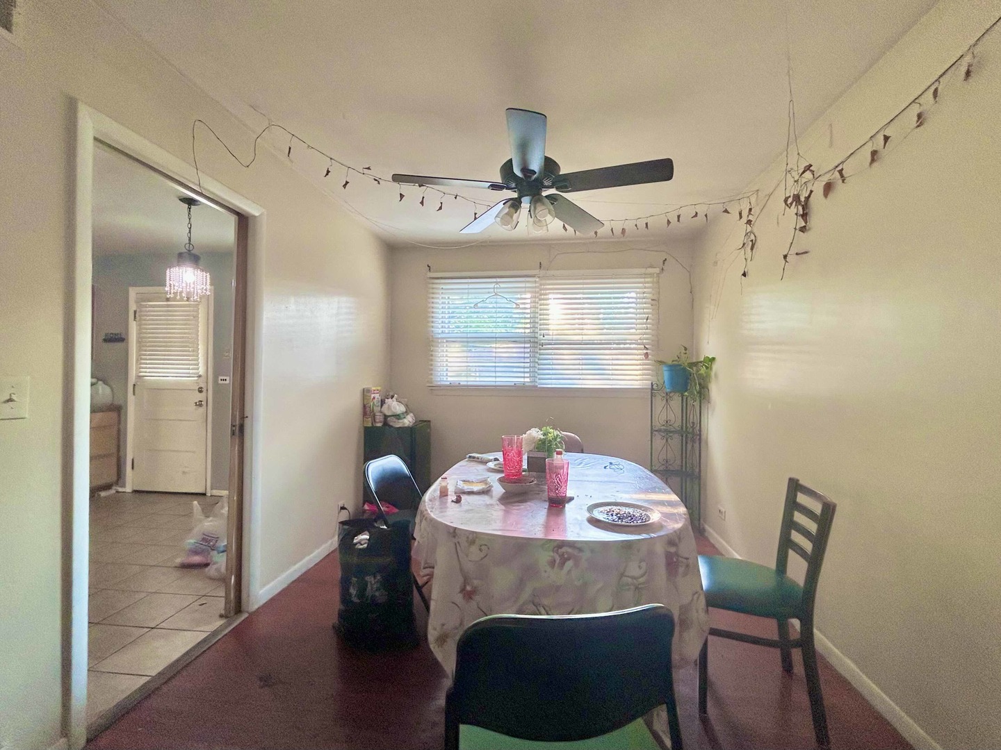 10 Adams Drive Addison, IL 60101 - Photo 5 of 12 a view of a dining room with furniture wooden floor and a chandelier