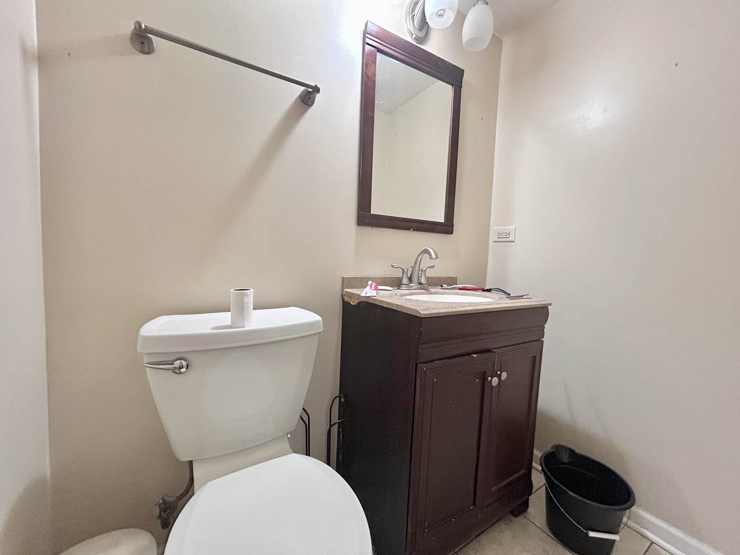 10 Adams Drive Addison, IL 60101 - Photo 6 of 12 a bathroom with a toilet sink and mirror