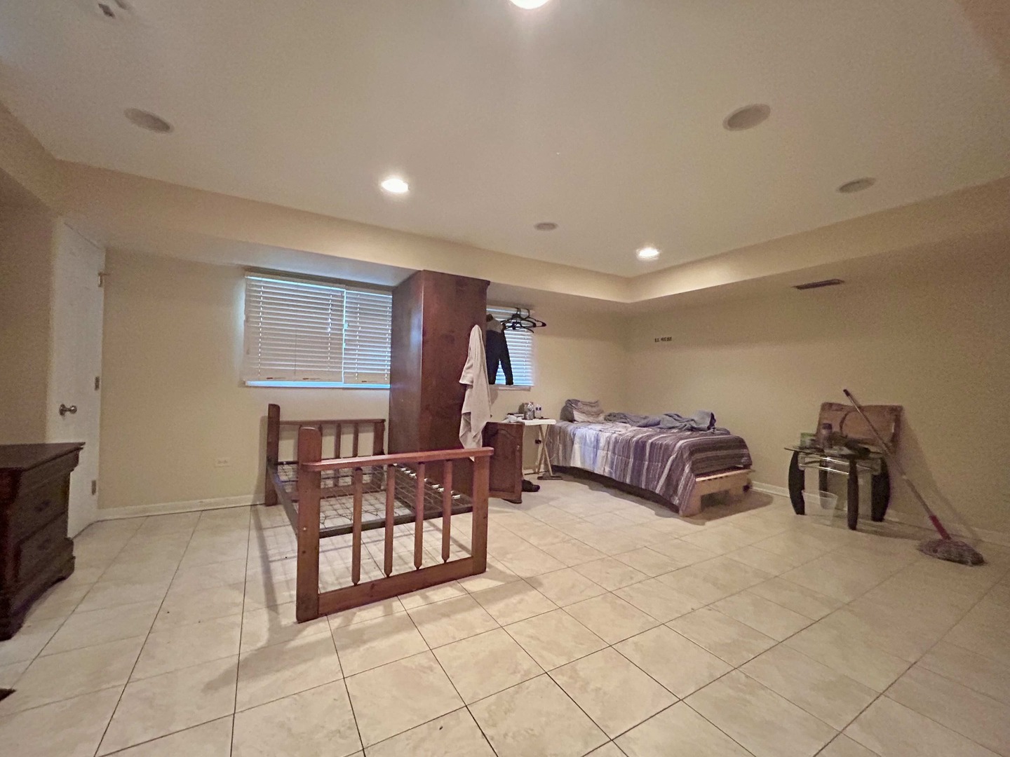 10 Adams Drive Addison, IL 60101 - Photo 9 of 12 a spacious bedroom with a bed and a table