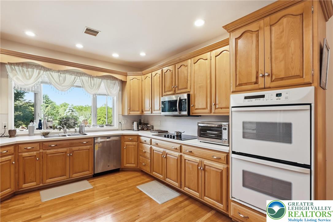 5217 Cider Press Road Schnecksville, PA 18078 - Photo 19 of 54 a kitchen with appliances cabinets and a sink