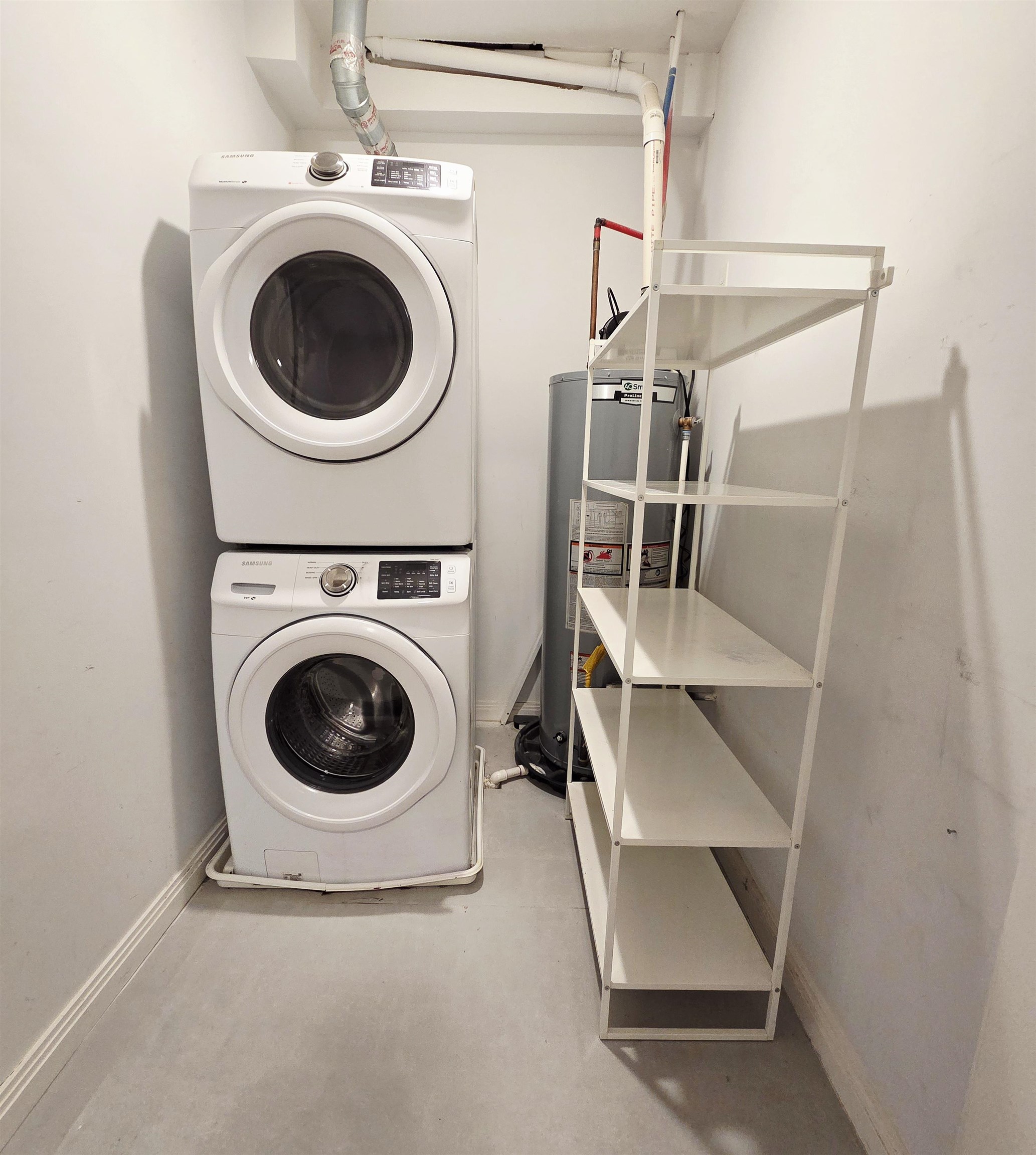 6809 Palisade Avenue, Unit 201 Guttenberg, NJ 07093 - Photo 9 of 11 a utility room with dryer and washer