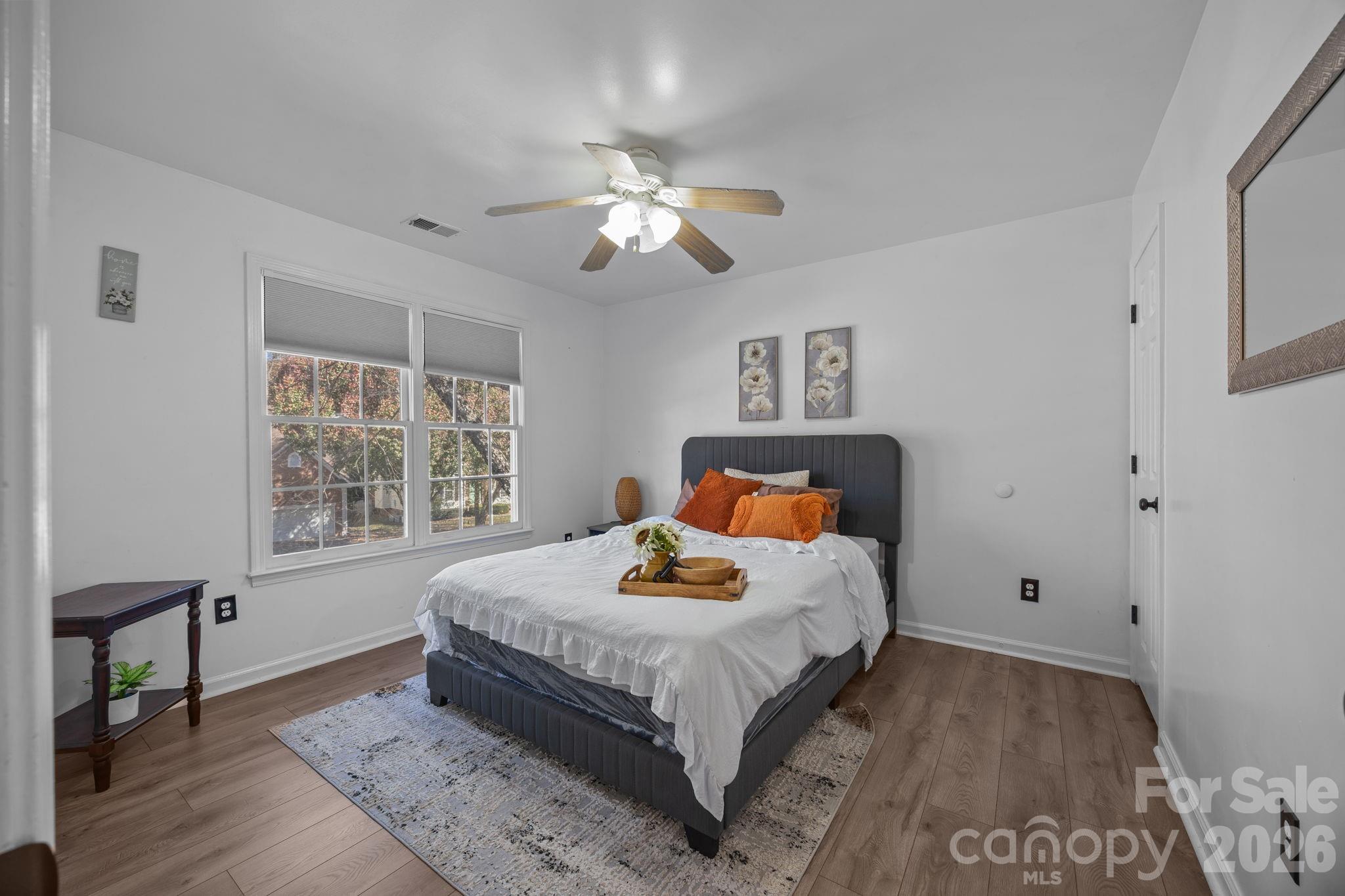 7708 Harrington Woods Road Charlotte, NC 28269 - Photo 25 of 35 a bedroom with bed and window