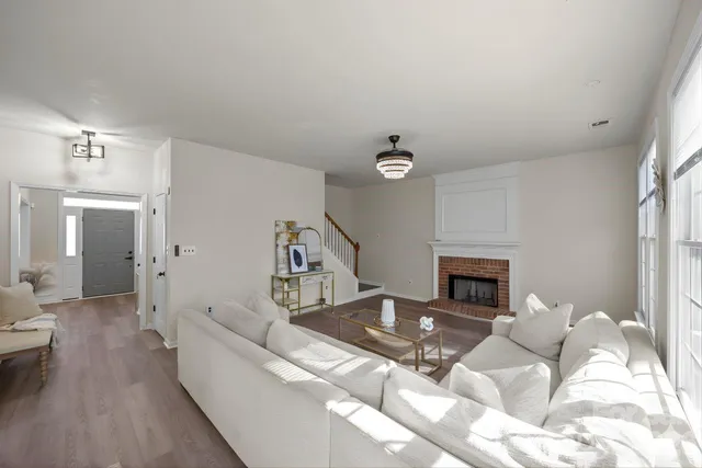 a dining room with wooden floor and a window