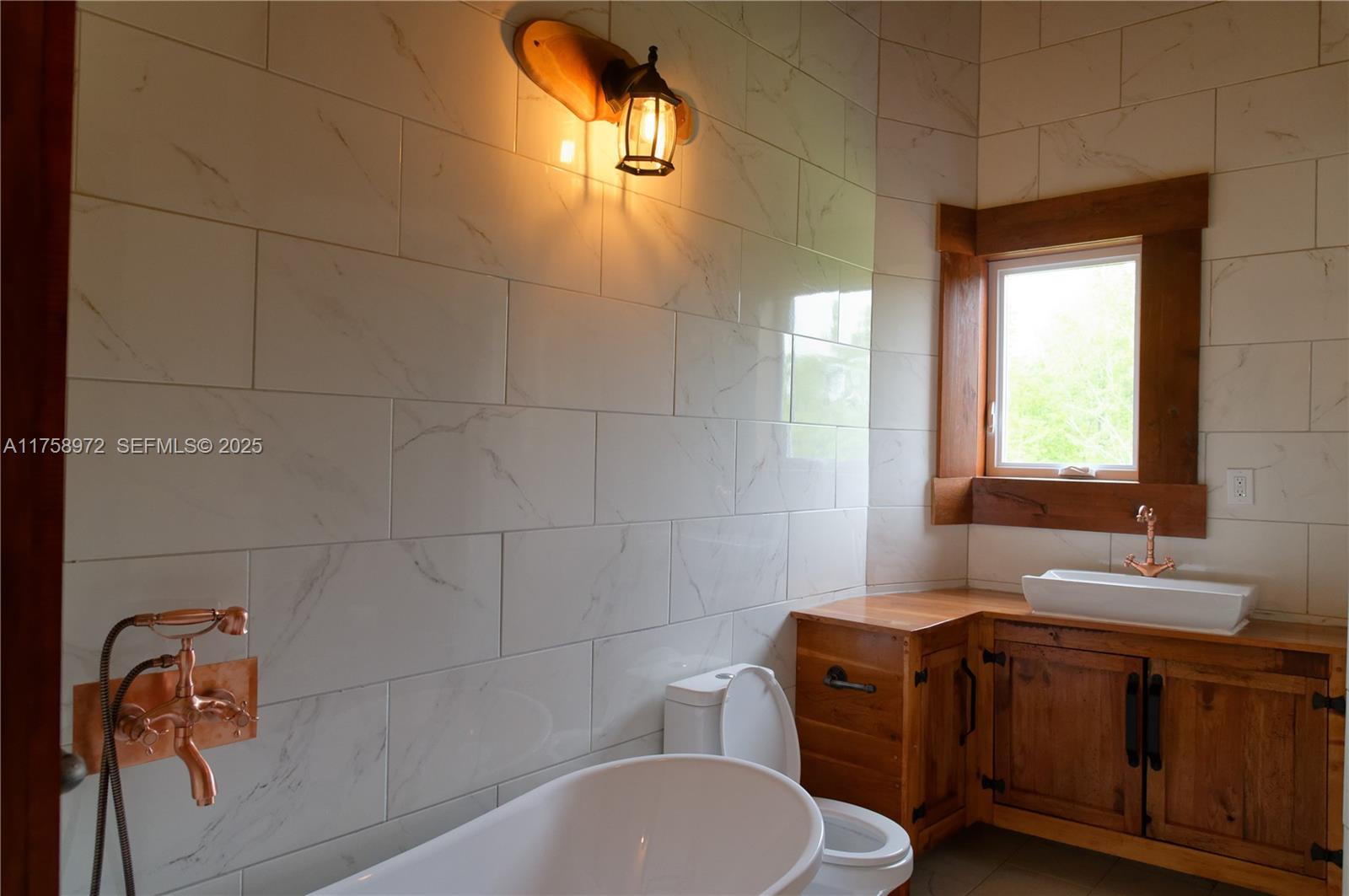 1150 10e Rang undefined, QC J0K 1Z0 - Photo 22 of 42 a bathroom with a sink a toilet and mirror