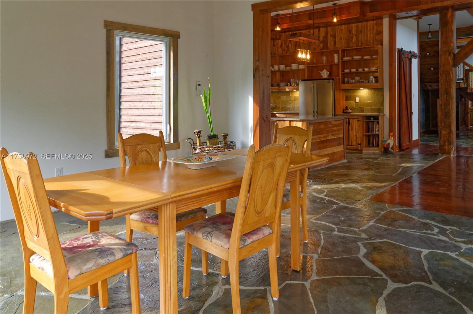 1150 10e Rang undefined, QC J0K 1Z0 - Photo 7 of 42 a view of a dining room with furniture and chandelier