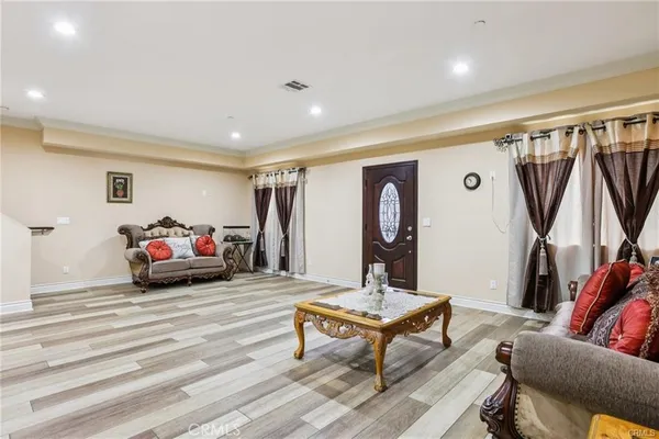 a living room with furniture and a rug
