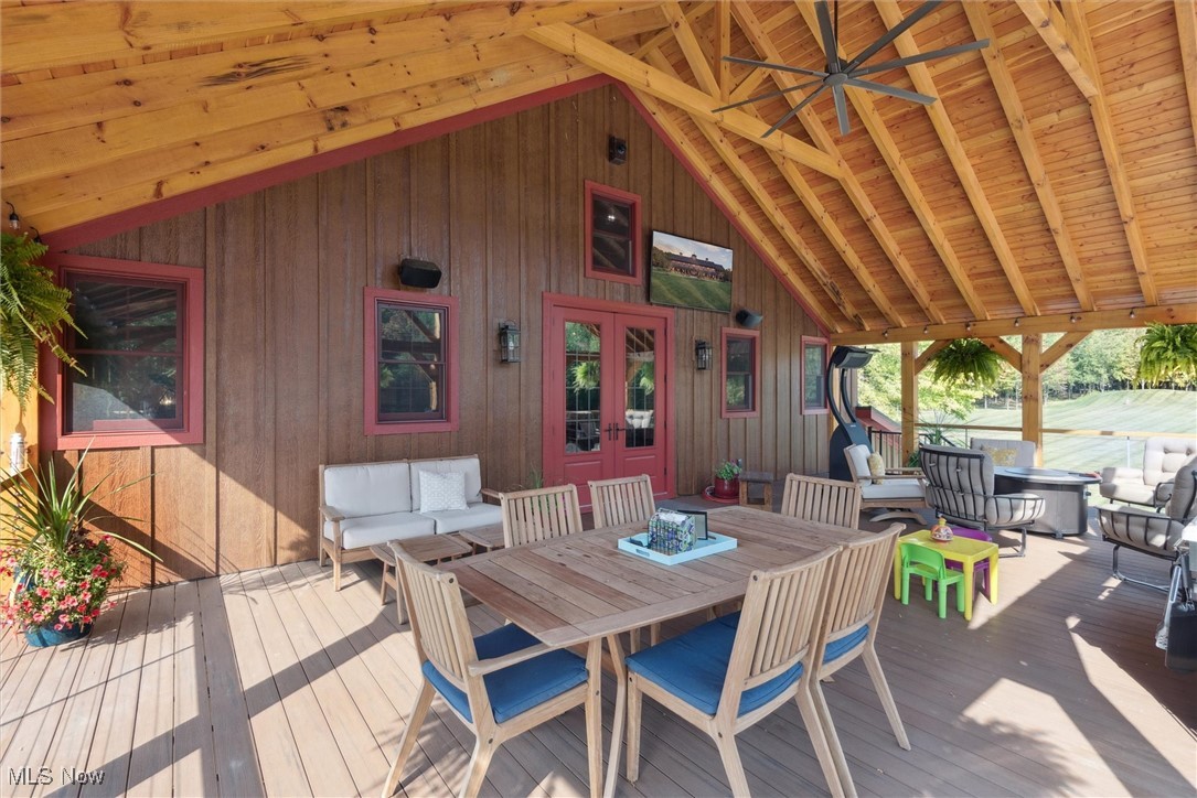 290 Townline Road Aurora, OH 44202 - Photo 28 of 50 Deck featuring an outdoor living space, outdoor dining area, and french doors