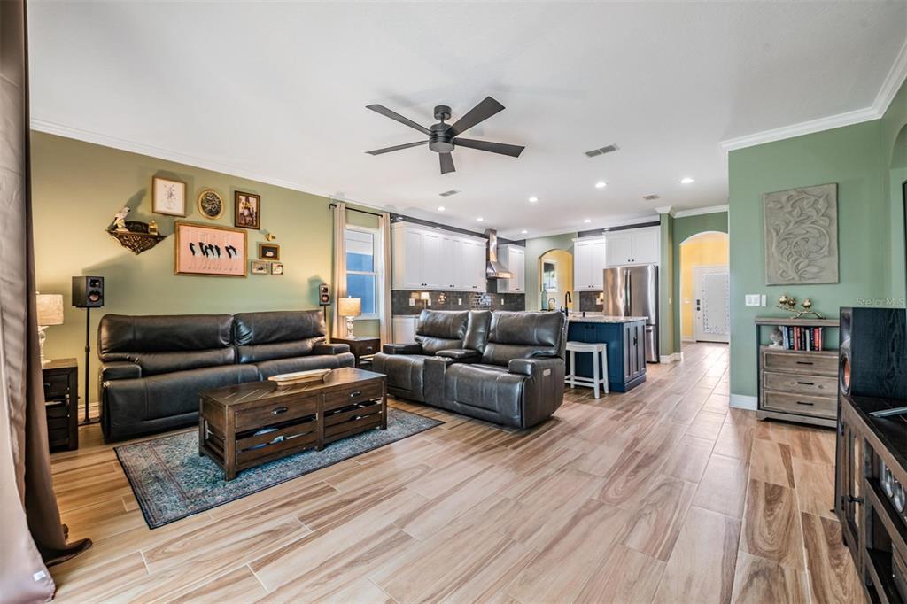 12902 Tikal Way Trinity, FL 34655 - Photo 14 of 43 a living room with furniture and wooden floor
