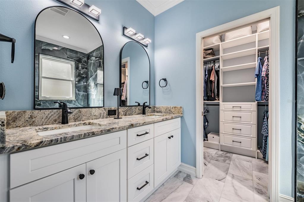 12902 Tikal Way Trinity, FL 34655 - Photo 15 of 43 a bathroom with a granite countertop sink and a mirror