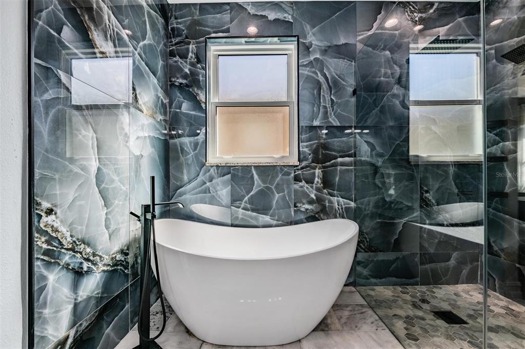 12902 Tikal Way Trinity, FL 34655 - Photo 16 of 43 a white bath tub sitting in a bathroom