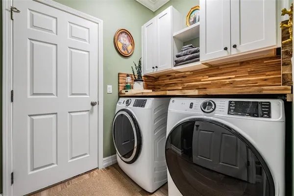 a utility room with dryer and washer